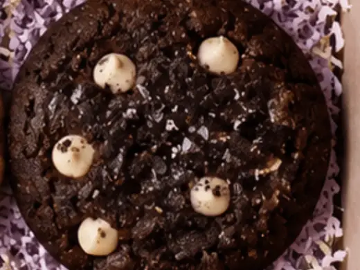 Double chocolate cookies stacked on a cooling rack
